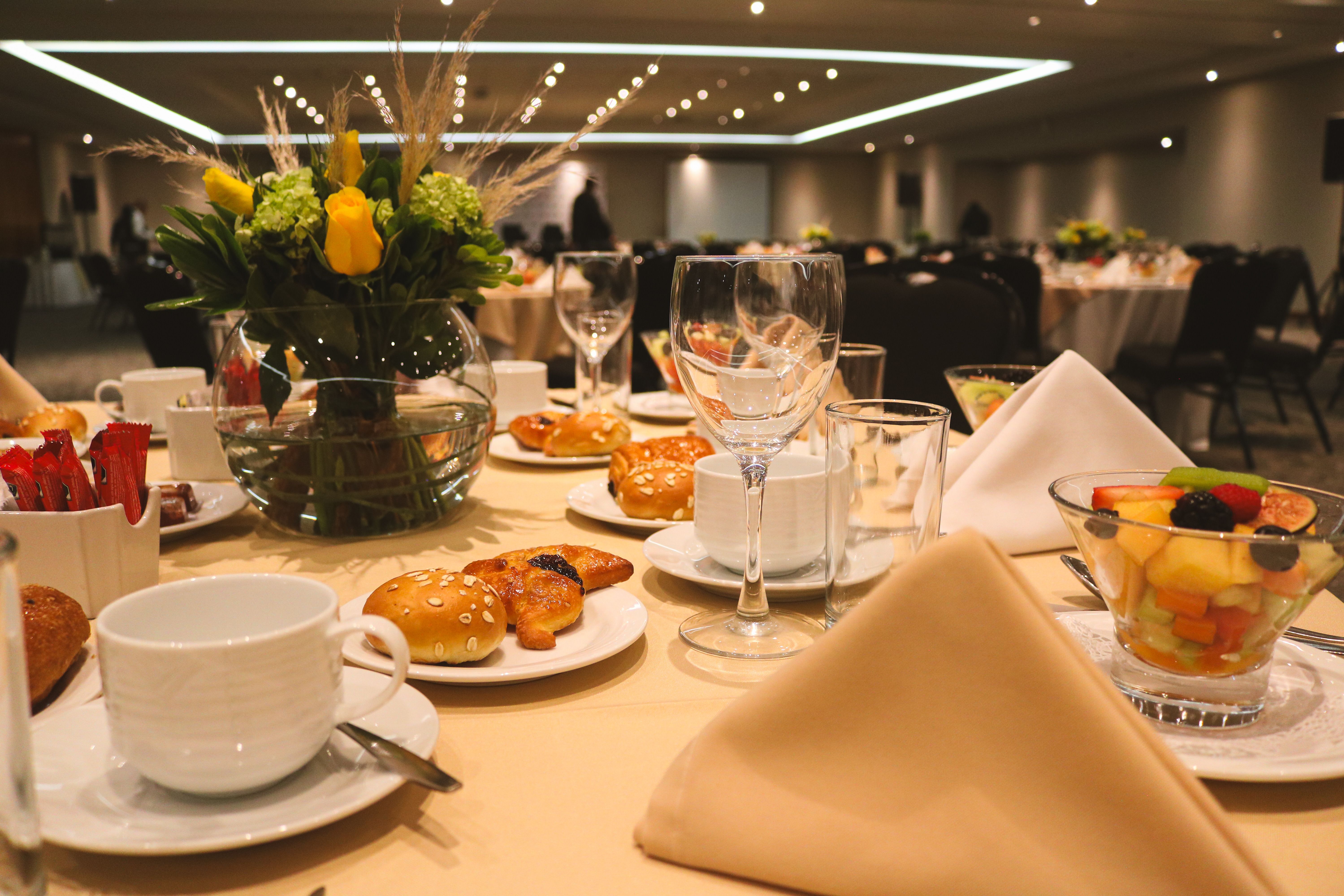 Elegant event venue with guests arriving for a sophisticated evening gala celebration
